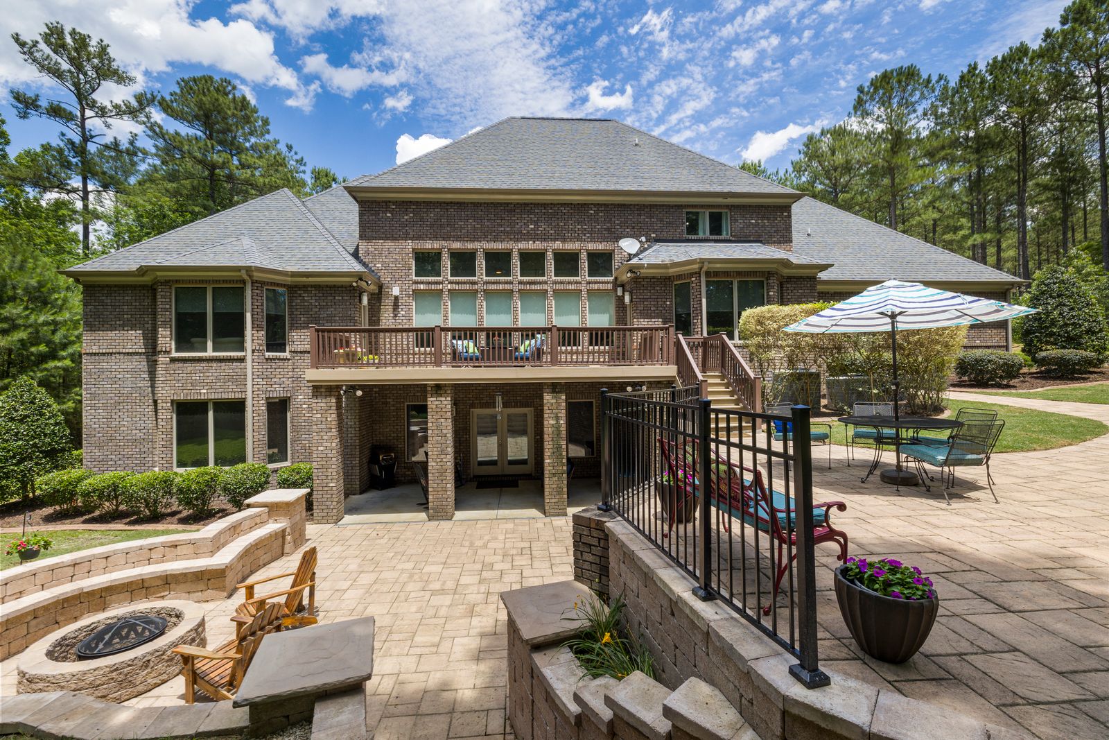 Landscaped backyard with paver patio and beds in the Upstate